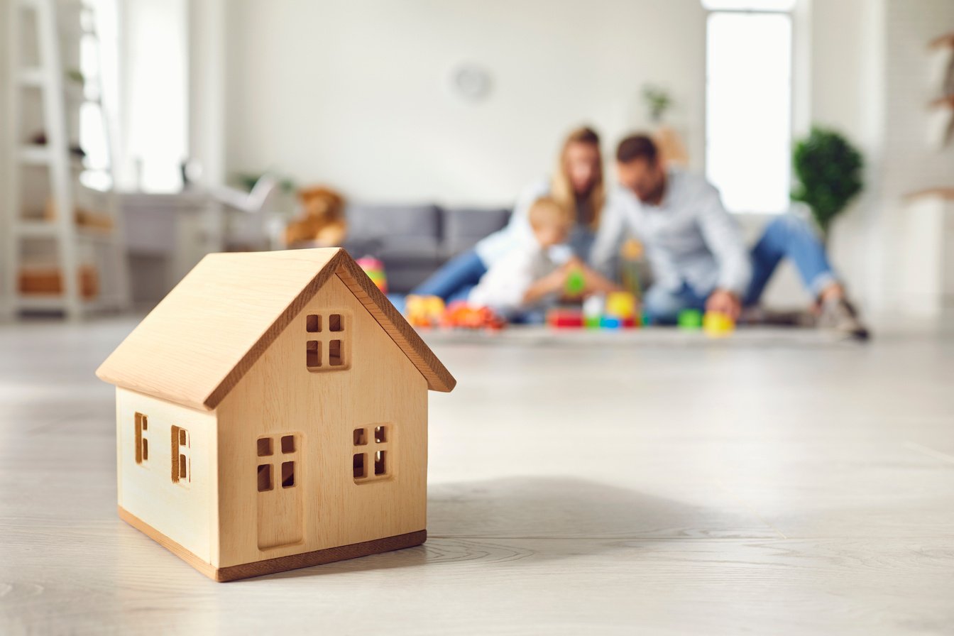 Griya pesona ciledug a toy house sits on the floor in front of a family